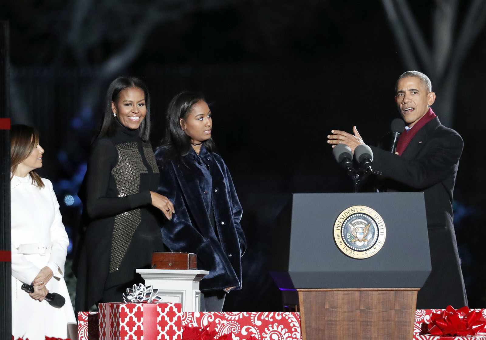 President Barack Obama, right, speaks, with Michelle Obama, and daughter Sasha, and entertainer Eva Longoria during the lighting ceremony for the 2016 National Christmas Tree is seen before the lighting ceremony on the Ellipse near the White House, Thursday, Dec. 1, 2016 in Washington. (AP Photo/Alex Brandon)