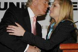 Miss USA 2006 Tara Conner, is kissed by Donald Trump after a news conference on Tuesday Dec. 19, 2006 in New York City. Conner, who had come under criticism amid rumors she had been frequenting bars while underage, will be allowed to keep her title, Donald Trump announced at the news conference.  (AP Photo/Rick Maiman)