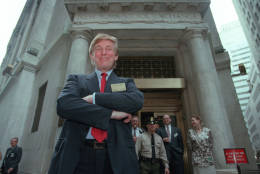Developer Donald Trump poses for photos outside the New York Stock Exchange after the listing of his stock on Wed., June 7, 1995 in New York.  He took his flagship Trump Plaza Casino public, offering 10 million shares of common stock at an estimated price of $14 per share.  (AP Photo/Kathy Willens)