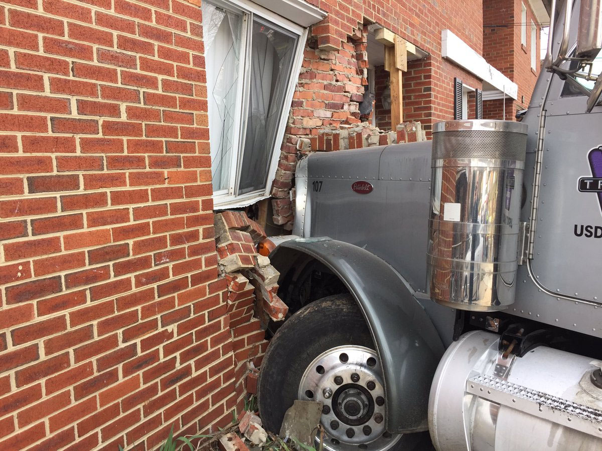 A dump truck crashed into an Oxon Hill town house Wednesday morning (Prince George's County Fire Department)