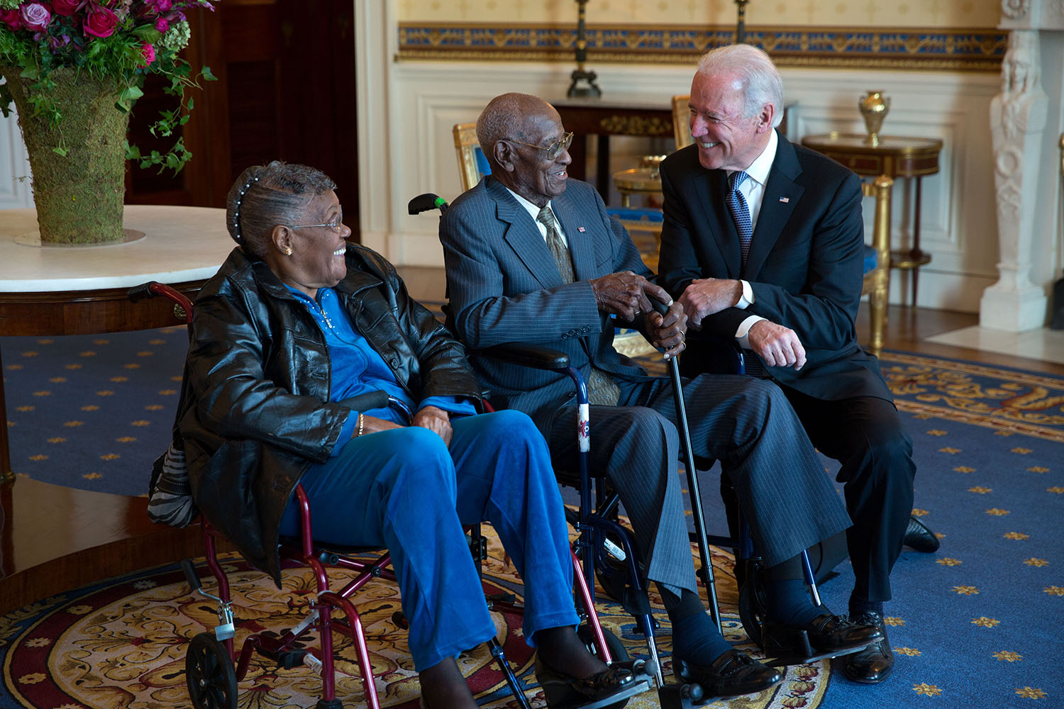 Vice President Joe Biden talks with Richard Overton and Earlene Love-Karo during a Veterans Day receiving line in the Blue Room of the White House, Nov. 11, 2013.  Mr. Overton, 107 years old, is the oldest living World War II veteran. (Official White House Photo by Lawrence Jackson)

This official White House photograph is being made available only for publication by news organizations and/or for personal use printing by the subject(s) of the photograph. The photograph may not be manipulated in any way and may not be used in commercial or political materials, advertisements, emails, products, promotions that in any way suggests approval or endorsement of the President, the First Family, or the White House.