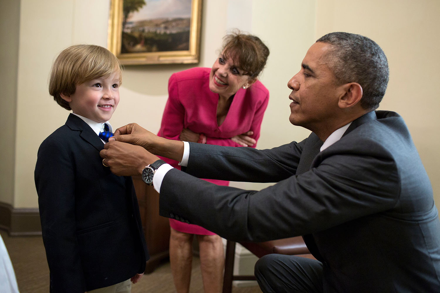President Barack Obama adjusts the tie of Coast Guard Military Aide Cdr. Scott S. Phy's son outside the Oval Office, June 12, 2014. Cdr. Phy and his family were in the Oval Office for an award citation and departure photos with the President. (Official White House Photo by Pete Souza)

This official White House photograph is being made available only for publication by news organizations and/or for personal use printing by the subject(s) of the photograph. The photograph may not be manipulated in any way and may not be used in commercial or political materials, advertisements, emails, products, promotions that in any way suggests approval or endorsement of the President, the First Family, or the White House.