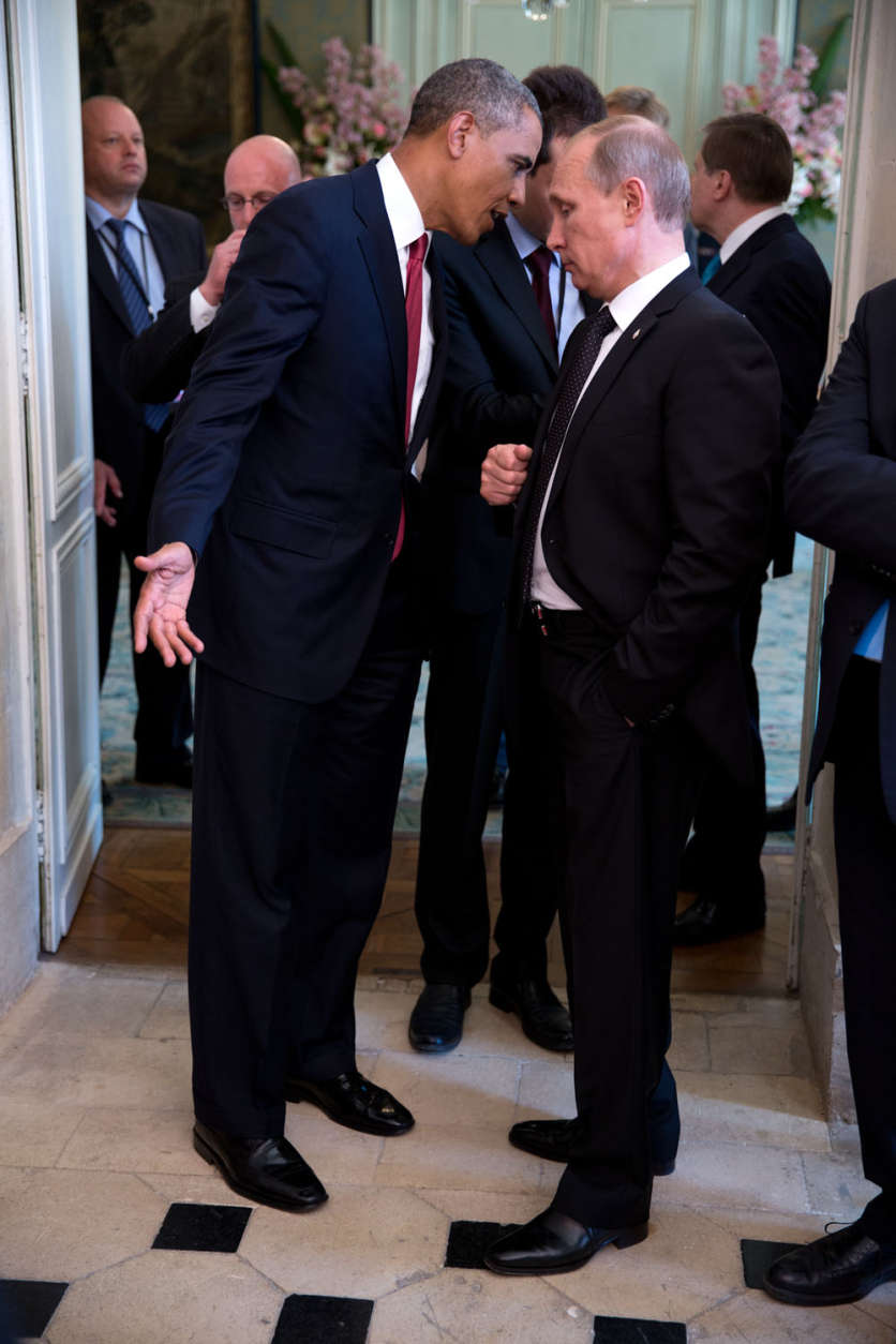 June 6, 2014
"The President talks with Russian President Vladimir Putin after a lunch with other foreign leaders to commemorate the 70th anniversary of D-Day in Normandy, France. I'm sure they were talking about a subject matter other than D-Day." 
(Official White House Photo by Pete Souza)

This official White House photograph is being made available only for publication by news organizations and/or for personal use printing by the subject(s) of the photograph. The photograph may not be manipulated in any way and may not be used in commercial or political materials, advertisements, emails, products, promotions that in any way suggests approval or endorsement of the President, the First Family, or the White House.
