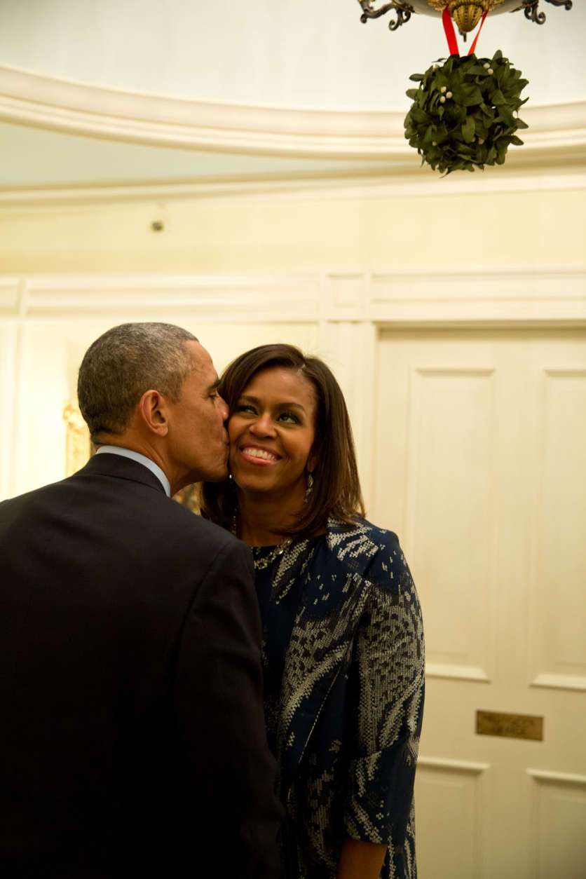 Dec. 3, 2014
"The First Lady and I both spotted the President standing under the mistletoe and she moved in to grab a kiss from him following a dinner for Combatant Commanders and military leadership at Blair House in Washington, D.C." 
(Official White House Photo by Pete Souza)

This official White House photograph is being made available only for publication by news organizations and/or for personal use printing by the subject(s) of the photograph. The photograph may not be manipulated in any way and may not be used in commercial or political materials, advertisements, emails, products, promotions that in any way suggests approval or endorsement of the President, the First Family, or the White House.