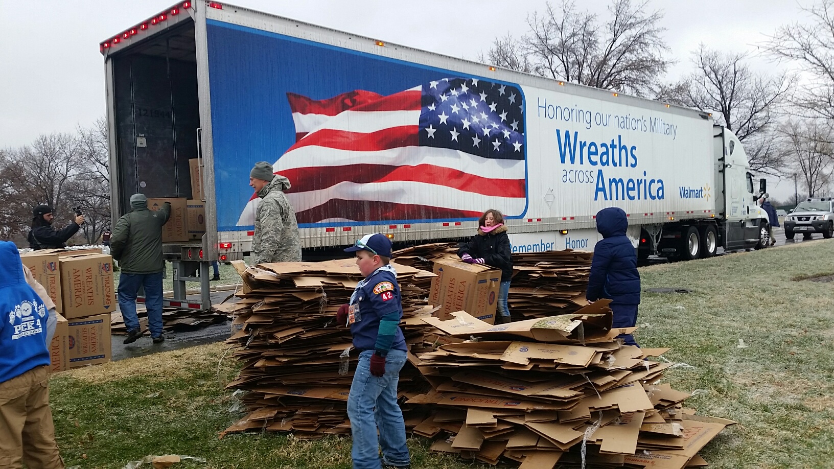 Empty boxes lay outside a truck that helped carry 245,000 remembrance wreaths that were placed at Arlington National Cemetery to honor veterans Saturday,  Dec. 17, 2016. (WTOP Kathy Stewart)