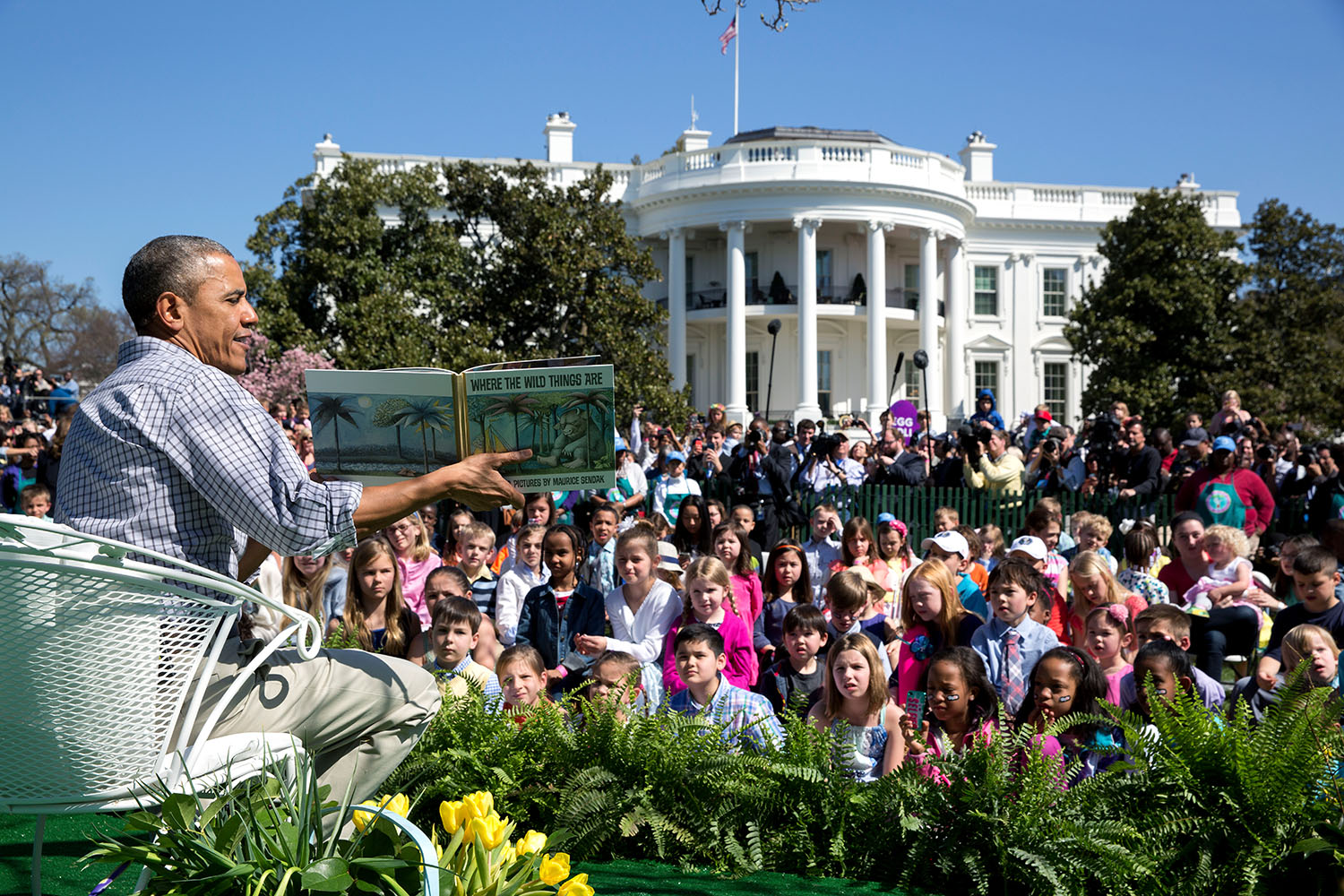 President Barack Obama reads "Where the Wild Things Are" by Maurice Sendak to children during the annual Easter Egg Roll on the South Lawn of the White House, April 6, 2015. (Official White House Photo by Pete Souza)

This official White House photograph is being made available only for publication by news organizations and/or for personal use printing by the subject(s) of the photograph. The photograph may not be manipulated in any way and may not be used in commercial or political materials, advertisements, emails, products, promotions that in any way suggests approval or endorsement of the President, the First Family, or the White House.