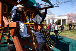 After greeting children and officials of the Children's Miracle Network at the White House, March 24, 2009, the President invited the children to try out his daughtersÕ new swing set on the edge of the Rose Garden. The Oval Office can be seen in the background.  (Official White House Photo by Lawrence Jackson)This official White House photograph is being made available for publication by news organizations and/or for personal use printing by the subject(s) of the photograph. The photograph may not be manipulated in any way or used in materials, advertisements, products, or promotions that in any way suggest approval or endorsement of the President, the First Family, or the White House.