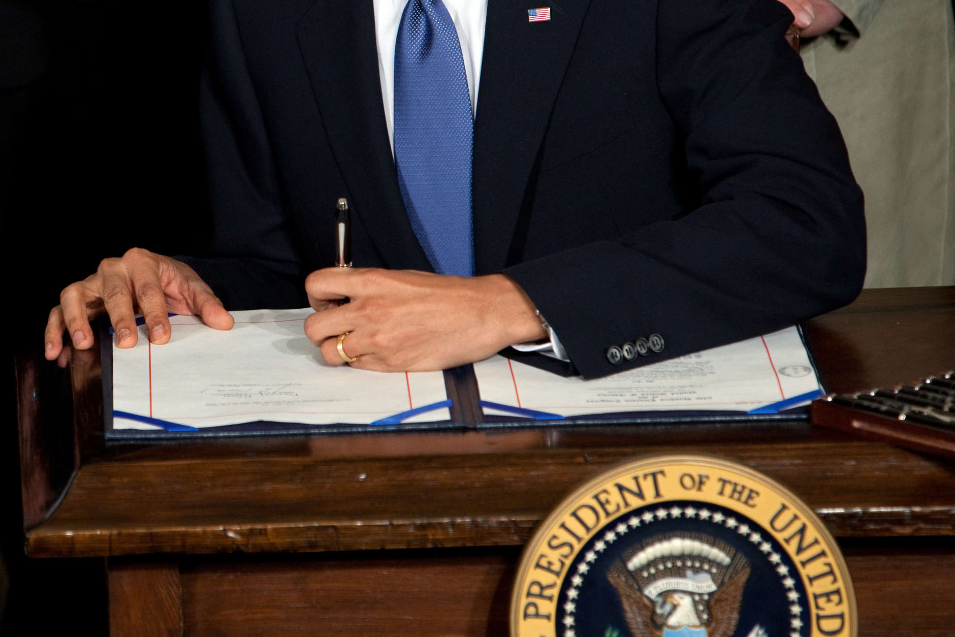 President Barack Obama signs the health insurance reform bill in the East Room of the White House, March 23, 2010. (Official White House Photo by Chuck Kennedy)

This official White House photograph is being made available only for publication by news organizations and/or for personal use printing by the subject(s) of the photograph. The photograph may not be manipulated in any way and may not be used in commercial or political materials, advertisements, emails, products, promotions that in any way suggests approval or endorsement of the President, the First Family, or the White House.