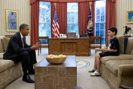 Oct. 10, 2011
"Nicky DeParle, son of Deputy Chief of Staff Nancy-Ann DeParle, was in the White House to visit his mother one afternoon on a school holiday. The President took a break between meetings to have a power bar with Nicky and check on how he was doing." 
(Official White House Photo by Pete Souza)

This official White House photograph is being made available only for publication by news organizations and/or for personal use printing by the subject(s) of the photograph. The photograph may not be manipulated in any way and may not be used in commercial or political materials, advertisements, emails, products, promotions that in any way suggests approval or endorsement of the President, the First Family, or the White House.Ê