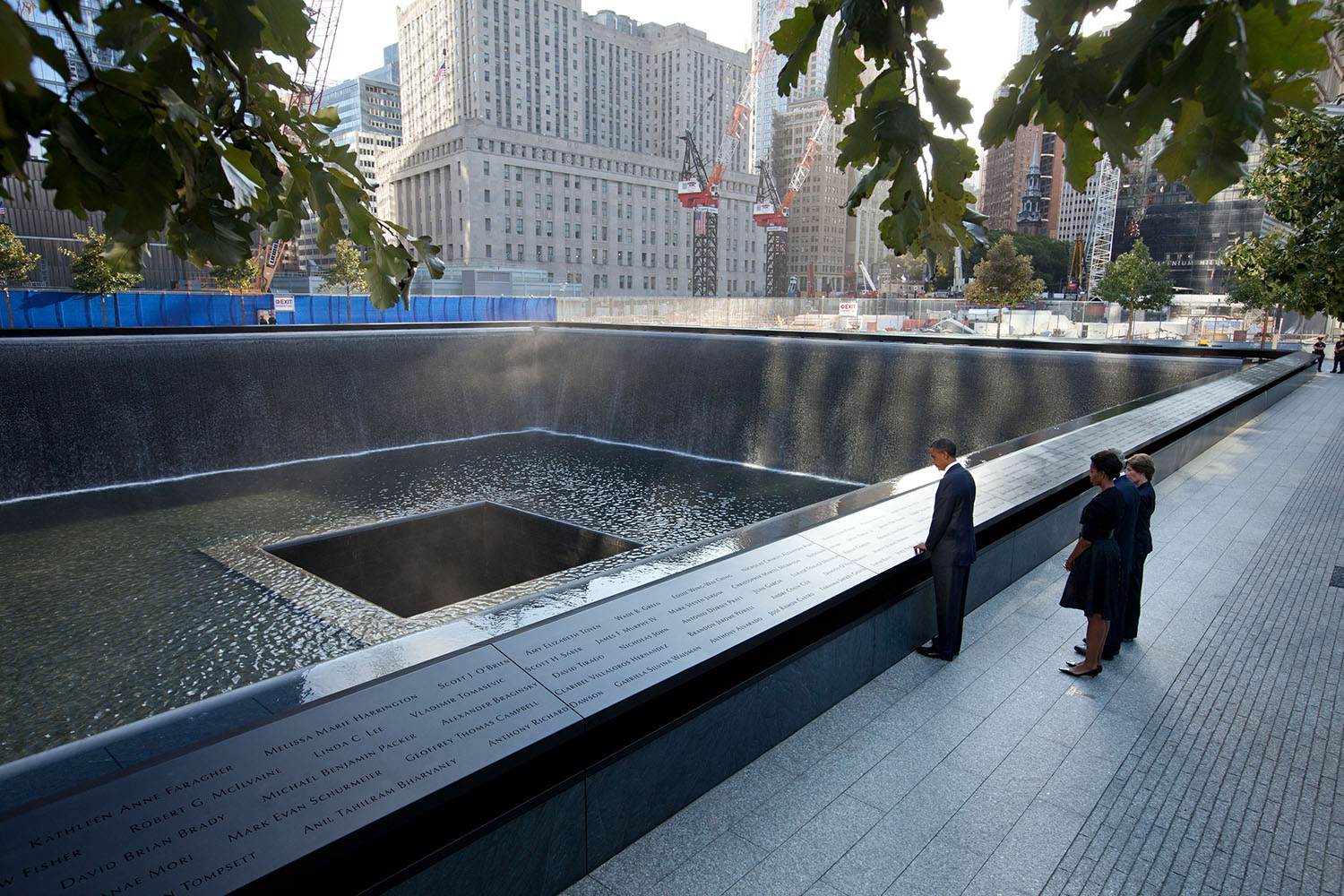 Sept. 11, 2011
"Chuck Kennedy captured this scene with a remote camera as the President and First Lady, along with former President George W. Bush and former First Lady Laura Bush, paused at the North Memorial Pool of the National September 11 Memorial in New York City. The North Memorial pool sits in the footprint of the north tower, formerly 1 World Trade Center." 
(Official White House Photo by Chuck Kennedy)

This official White House photograph is being made available only for publication by news organizations and/or for personal use printing by the subject(s) of the photograph. The photograph may not be manipulated in any way and may not be used in commercial or political materials, advertisements, emails, products, promotions that in any way suggests approval or endorsement of the President, the First Family, or the White House.