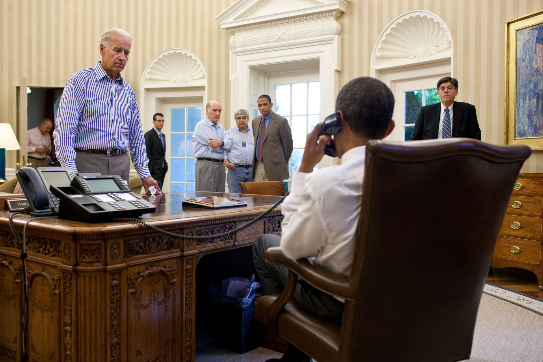 July 31, 2011
"The Vice President and other staff watch and listen as the President talks on the phone in the Oval Office with Senate Majority Leader Harry Reid during the debt limit and deficit discussions." 
(Official White House Photo by Pete Souza)

This official White House photograph is being made available only for publication by news organizations and/or for personal use printing by the subject(s) of the photograph. The photograph may not be manipulated in any way and may not be used in commercial or political materials, advertisements, emails, products, promotions that in any way suggests approval or endorsement of the President, the First Family, or the White House.Ê