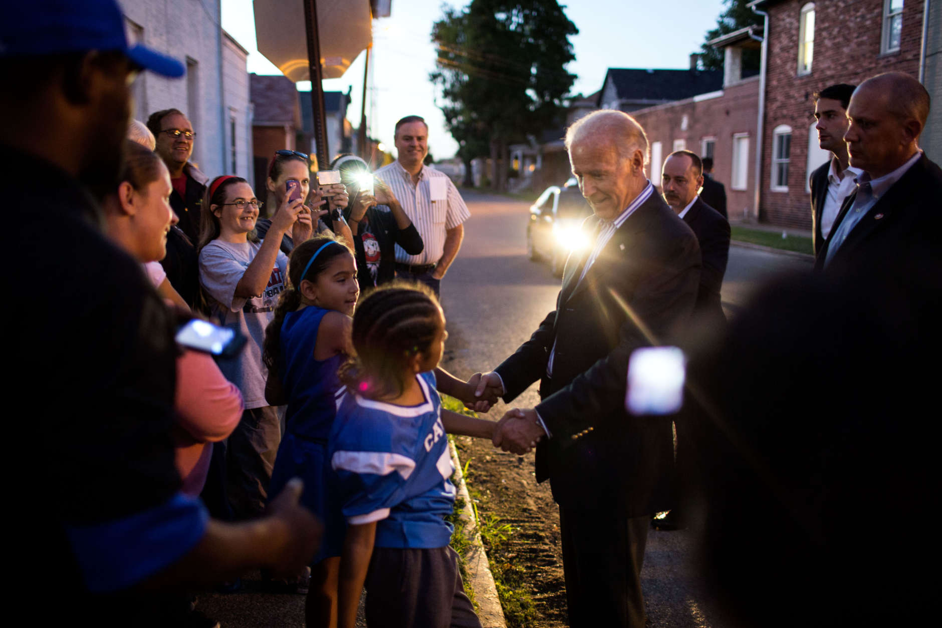 Sept. 8, 2012
"I love the headlight on the vehicle helping to light this frame taken by David Lienemann as the Vice President Joe greets people gathered outside the Obama For America field office in Chillicothe, Ohio." 
(Official White House Photo by David Lienemann)

This official White House photograph is being made available only for publication by news organizations and/or for personal use printing by the subject(s) of the photograph. The photograph may not be manipulated in any way and may not be used in commercial or political materials, advertisements, emails, products, promotions that in any way suggests approval or endorsement of the President, the First Family, or the White House.