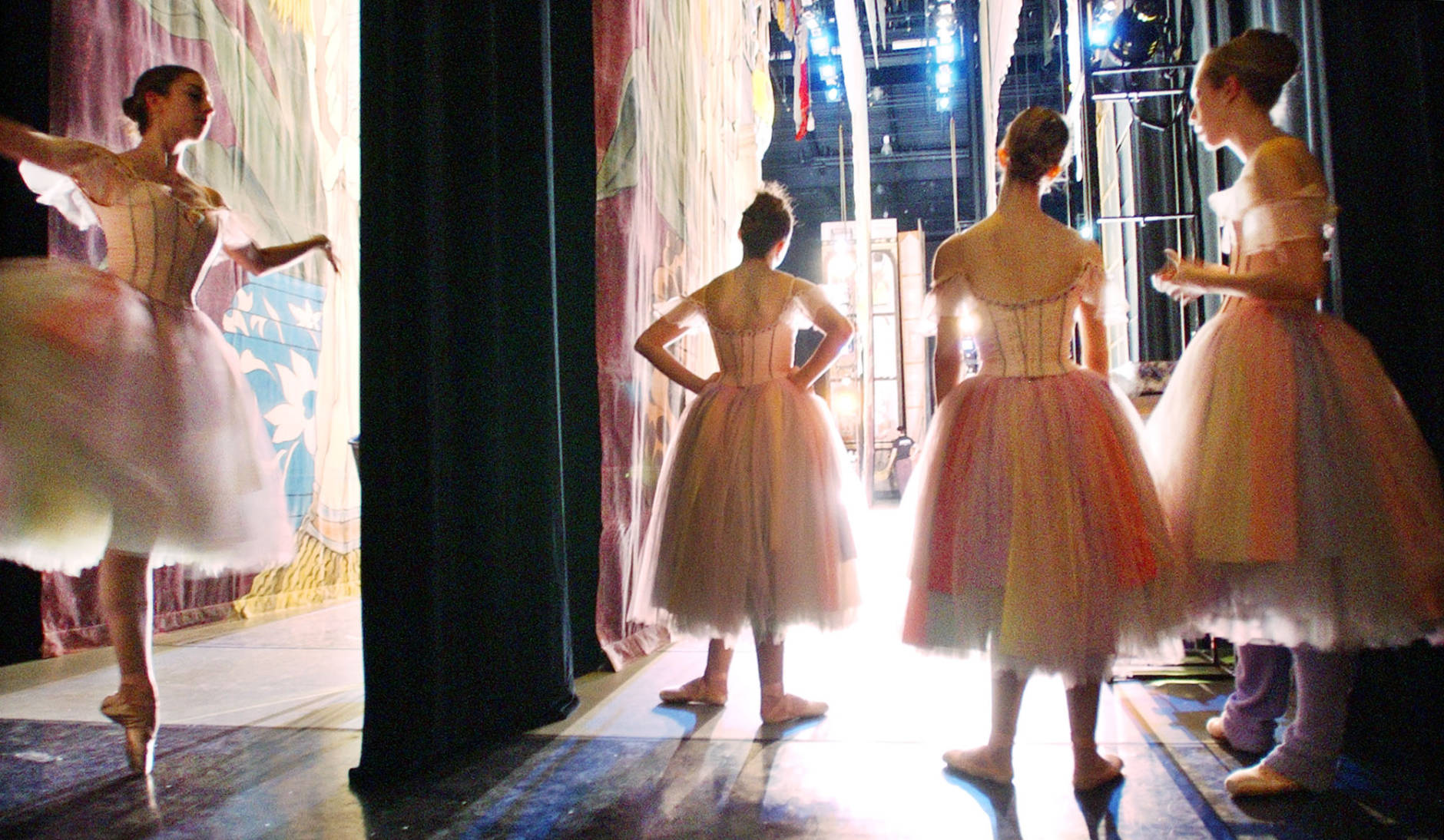 Company dancers wait their turn backstage at a rehersal of Pacific Northwest Ballet's 20th anniversary of ''The Nutcracker,'' Wednesday, Nov. 26, 2003, in Seattle. The Nutcracker opens Friday, Nov. 28, and runs through Dec. 28 at the new McCaw Hall. Over 250 ballet students and 50 company dancers are included in three casts during the 33 performance run. (AP Photo/Elaine Thompson)