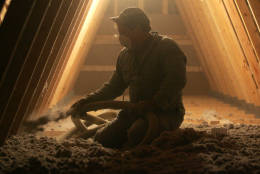 Mike Arick of Arick and Sons Insulation Co. in Columbus, Ohio, blows cellulose insulation into the attic of a pole barn at a residence in Powell, Ohio, Friday, Jan. 20, 2006. (AP Photo/Paul Vernon)