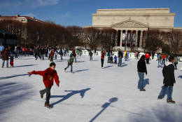 People ice skate at the National Gallery of Art's Sculpture Garden in Washington, on Thursday, Dec. 24, 2009.  (AP Photo/Jacquelyn Martin)