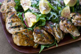 This Aug. 15, 2011 photo shows Rocco DiSpirito's warm salad of grilled chicken thighs, figs and shaved Parmigiano-Reggiano.  Before serving this dish, place the chicken thigh halves around the salad, then sprinkle the salad with the shaved Parmigiano-Reggiano.    (AP Photo/Matthew Mead)