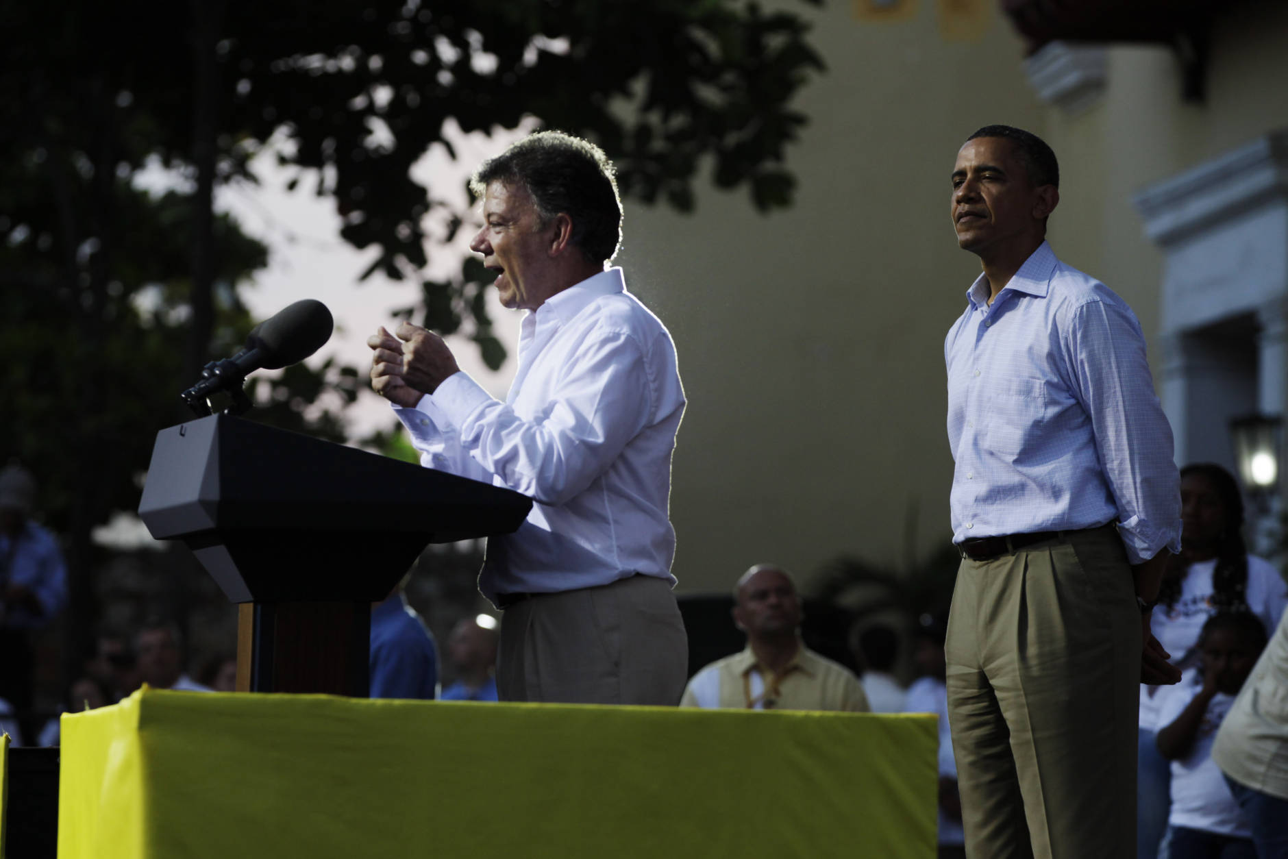 President Barack Obama, right, listens to Colombia's President Juan Manuel Santos during a land titling event for Afro-Colombian communities in Cartagena, Colombia, Sunday, April 15, 2012. (AP Photo/Carolyn Kaster)