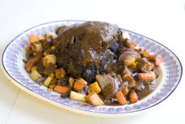 This Nov. 11, 2013 photo shows holiday pot roast with spiced root vegetables in Concord, N.H. This recipe is designed to give maximum flavor with minimum labor. (AP Photo/Matthew Mead)