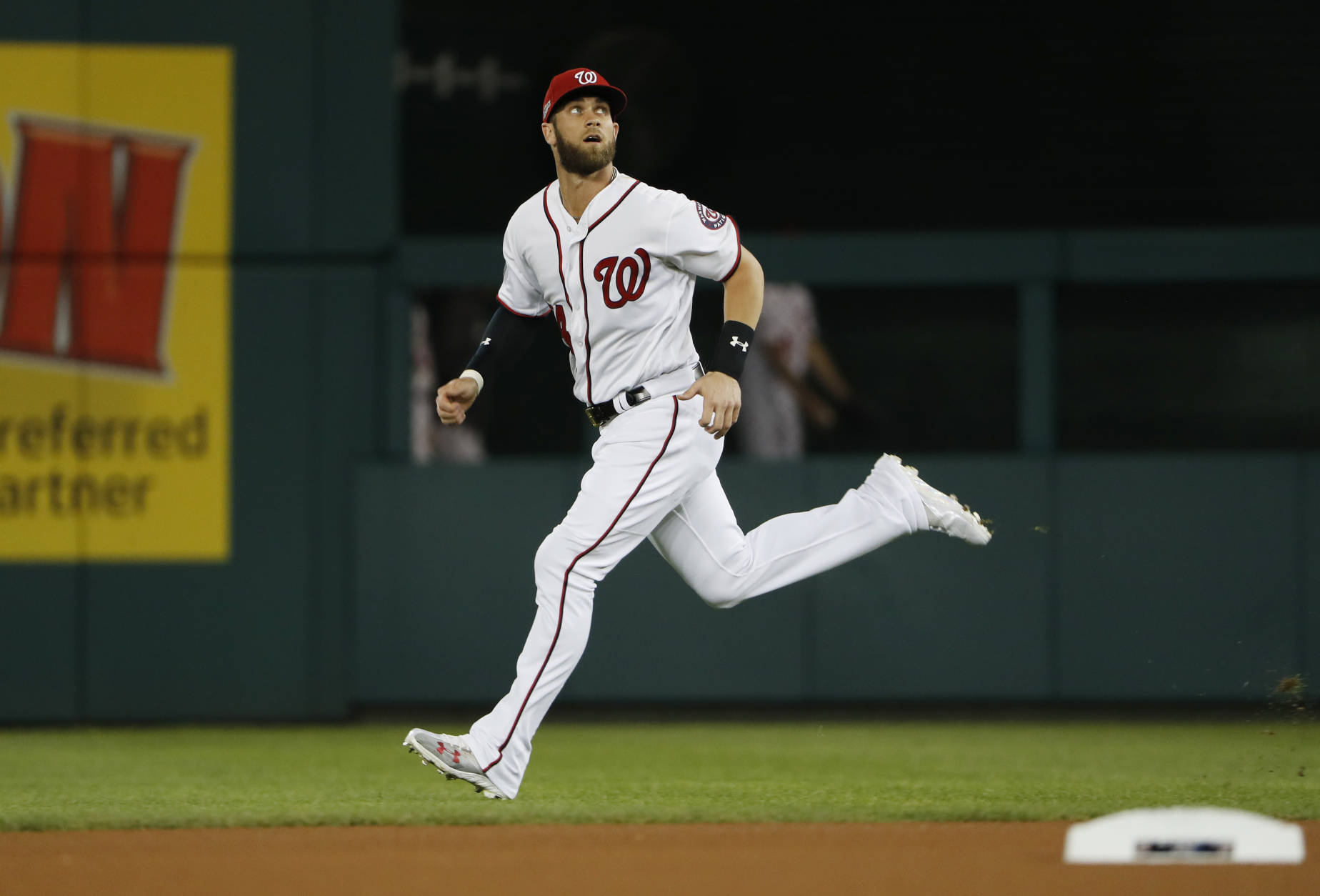 Washington Nationals right fielder Bryce Harper warms up before Game 5 of baseball's National League Division Series, against the Los Angeles Dodgers at Nationals Park, Thursday, Oct. 13, 2016, in Washington. (AP Photo/Pablo Martinez Monsivais)