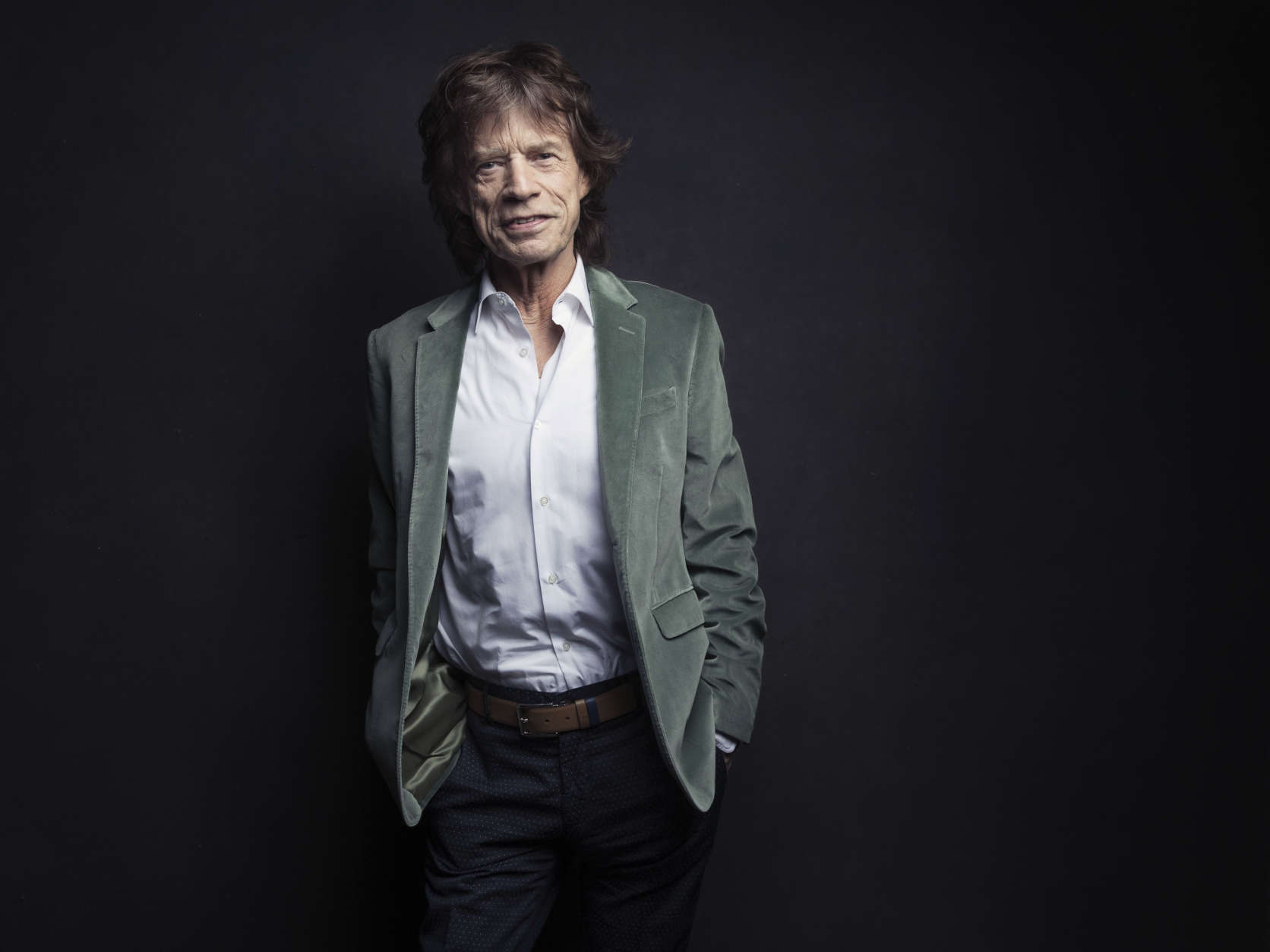 Mick Jagger of the Rolling Stones poses for a portrait on Monday, Nov. 14, 2016, in New York. Jagger was coming up with ideas for an exhibition highlighting The Rolling Stones' five-decade long career, he wanted to re-create the mood of the band in their early years. So, he had a team re-make the first - and messy - London apartment he shared with his band mates in 1962, complete with dirty dishes, beer bottles and blues records placed throughout the flat. (Photo by Victoria Will/Invision/AP)