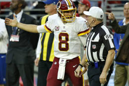 Washington Redskins quarterback Kirk Cousins (8) argues a call with referee Walt Anderson (66) during the second half of an NFL football game against the Arizona Cardinals, Sunday, Dec. 4, 2016, in Glendale, Ariz. (AP Photo/Ross D. Franklin)