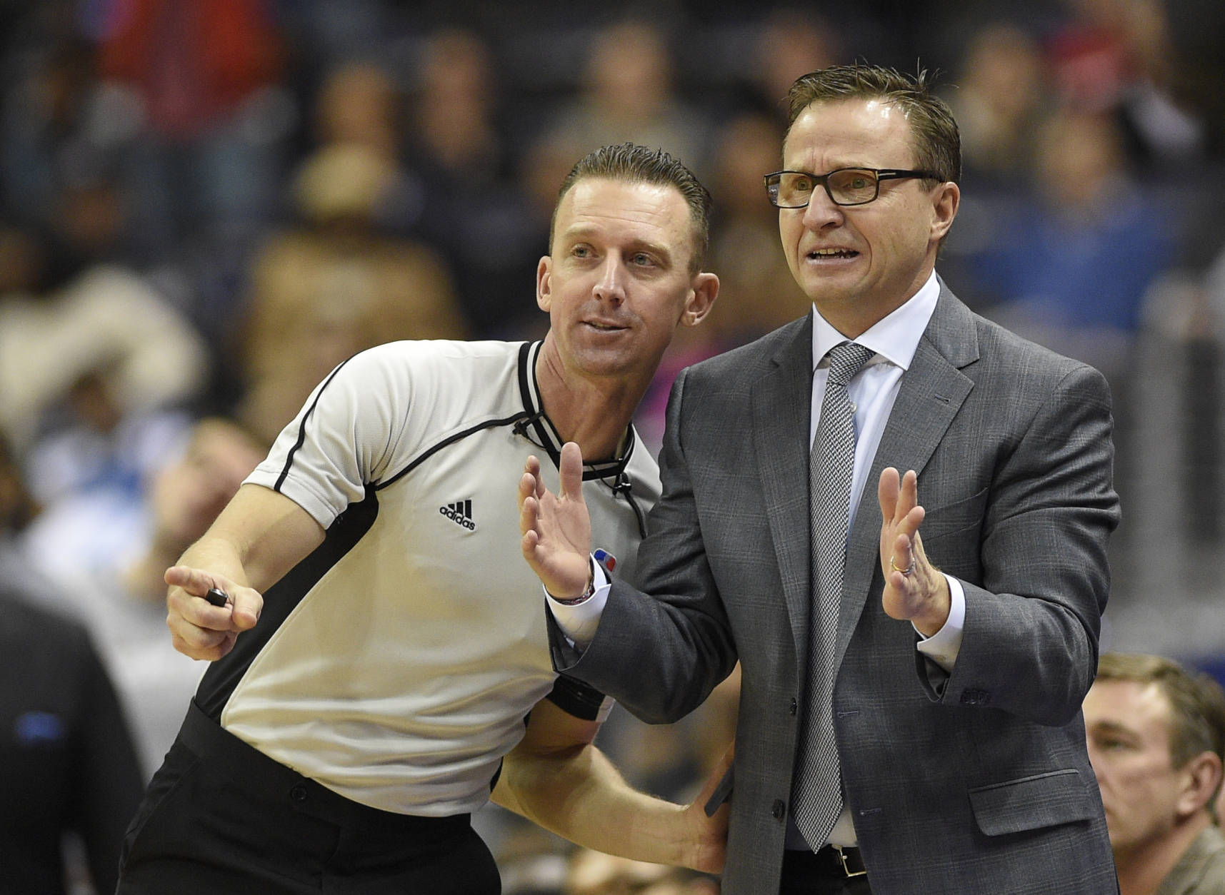 Washington Wizards head coach Scott Brooks, right, gestures next to referee Justin Van Duyne, left, during the second half of an NBA basketball game against the Denver Nuggets, Thursday, Dec. 8, 2016, in Washington. The Wizards won 92-85. (AP Photo/Nick Wass)