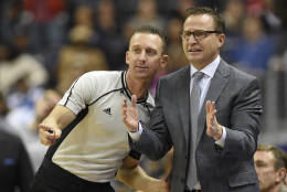 Washington Wizards head coach Scott Brooks, right, gestures next to referee Justin Van Duyne, left, during the second half of an NBA basketball game against the Denver Nuggets, Thursday, Dec. 8, 2016, in Washington. The Wizards won 92-85. (AP Photo/Nick Wass)