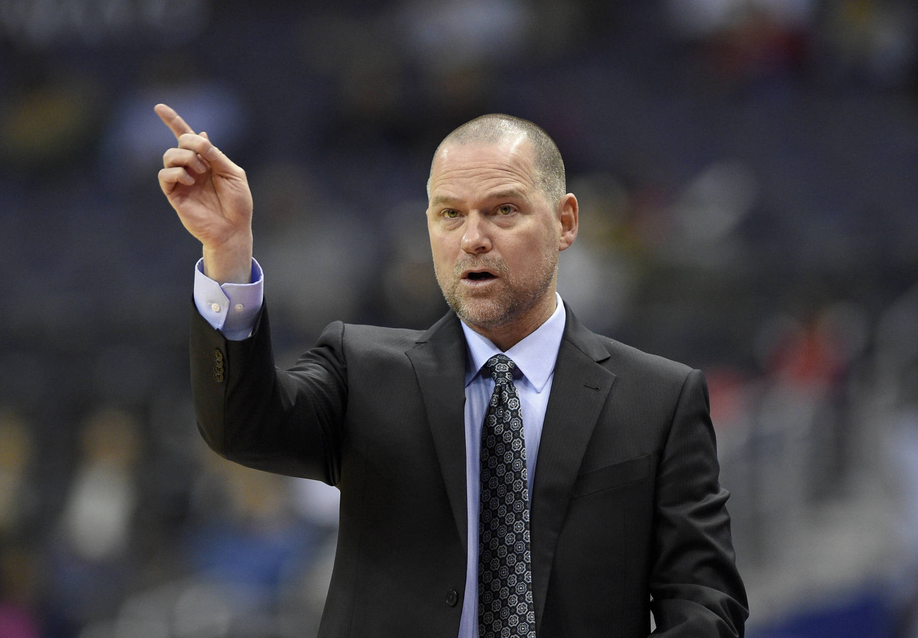 Denver Nuggets head coach Michael Malone gestures during the first half of an NBA basketball game against the Washington Wizards, Thursday, Dec. 8, 2016, in Washington. (AP Photo/Nick Wass)