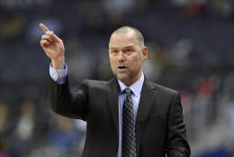 Denver Nuggets head coach Michael Malone gestures during the first half of an NBA basketball game against the Washington Wizards, Thursday, Dec. 8, 2016, in Washington. (AP Photo/Nick Wass)