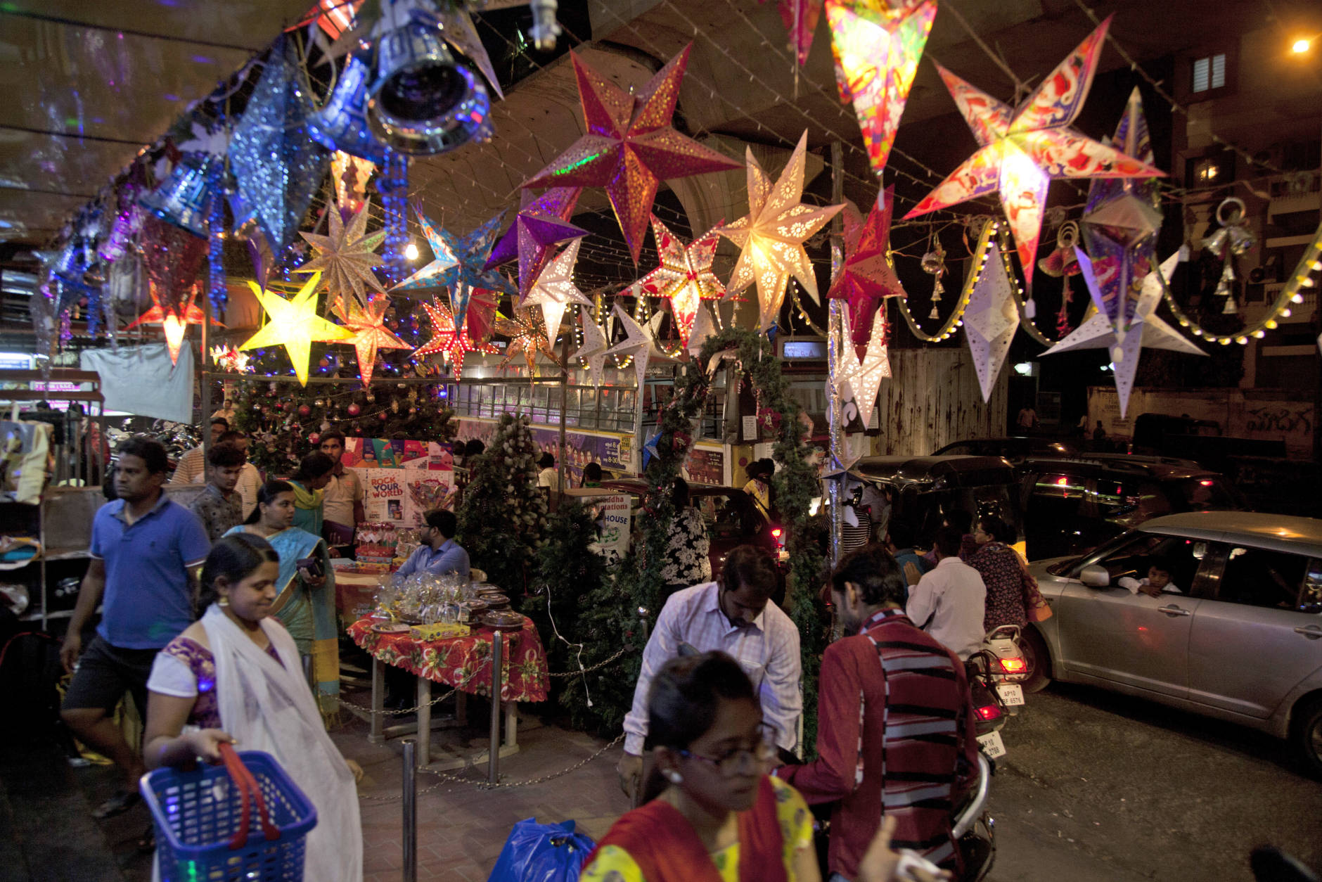 Indians shop on the eve of Christmas in Hyderabad, India, Saturday, Dec. 24, 2016. Though the Hindus and Muslims comprise majority of the population in India, Christmas is a national holiday celebrated with much fanfare. (AP Photo/Mahesh Kumar A.)