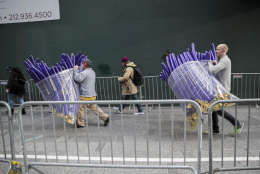 Times Square Business Improvement District workers carry balloons that will be handed out to revelers during the New Years celebration, Friday, Dec. 30, 2016, in New York's Times Square. (AP Photo/Mary Altaffer)