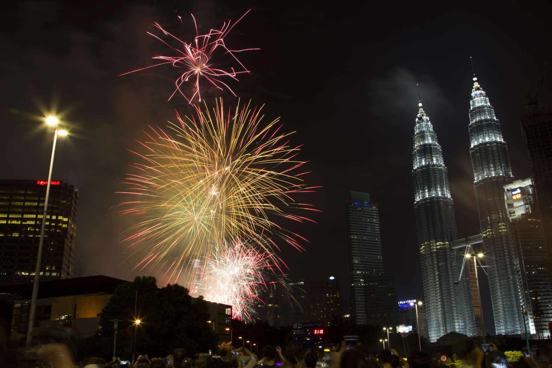 Fireworks explode in front of Malaysia's landmark building, Petronas Twin Towers, during the New Year's Eve celebration in Kuala Lumpur, Malaysia, early Sunday, Jan. 1, 2017. (AP Photo/Lim Huey Teng)