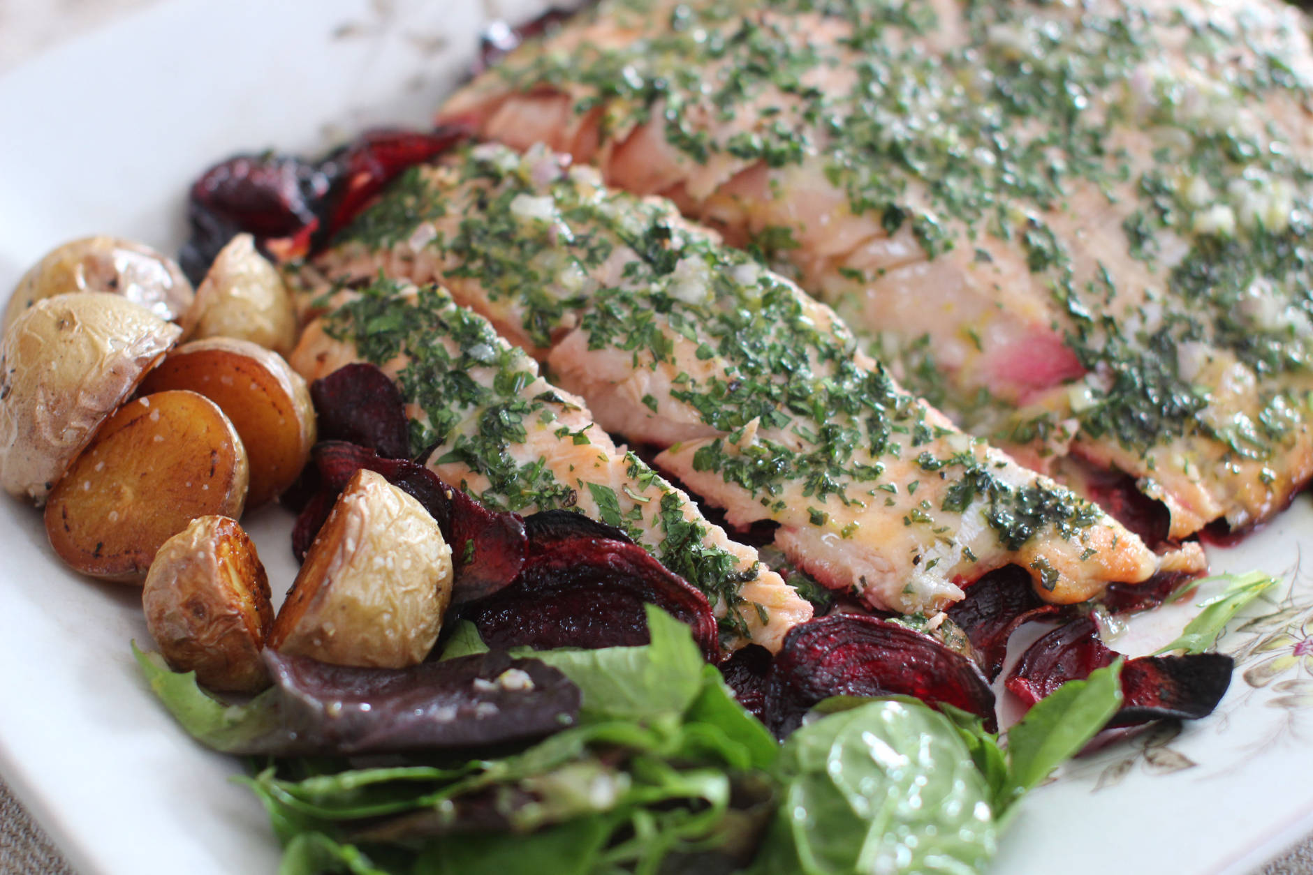 This Feb. 23, 2015 photo shows roasted salmon and beets with herb vinaigrette in Concord, N.H. (AP Photo/Matthew Mead)