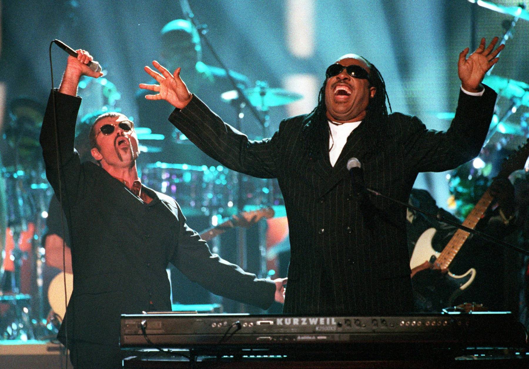 George Michael, left, and Stevie Wonder perform "Living for the City" at the "4th annual VH1 Honors" Thursday night, April 10, 1997, in Universal City, Calif. (AP Photo/Mark J. Terrill)
