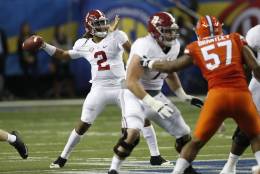 Alabama quarterback Jalen Hurts (2) works against Florida during the first half of the Southeastern Conference championship NCAA college football game, Saturday, Dec. 3, 2016, in Atlanta.(AP Photo/John Bazemore)