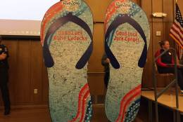 Jolly Green Giant-sized flip flops for Ledecky and Conger were signed by countless supporters. (WTOP/Michelle Basch)