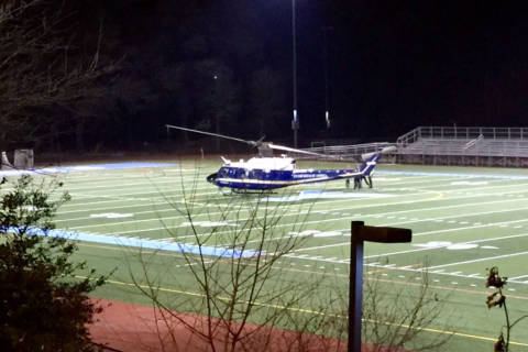 Helicopter lands in Arlington high school field