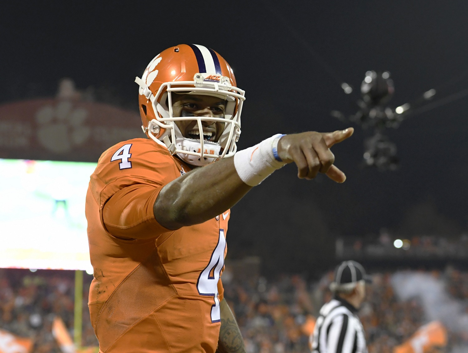 FILE - In this Nov. 26, 2016, file photo, Clemson quarterback Deshaun Watson reacts after throwing a touchdown pass to Artavis Scott during the second half of an NCAA college football game against South Carolina, in Clemson, S.C. Lamar Jackson stumbled down the stretch, leaving the rest of the field one last chance to catch him in the Heisman Trophy race. (AP Photo/Richard Shiro, File)