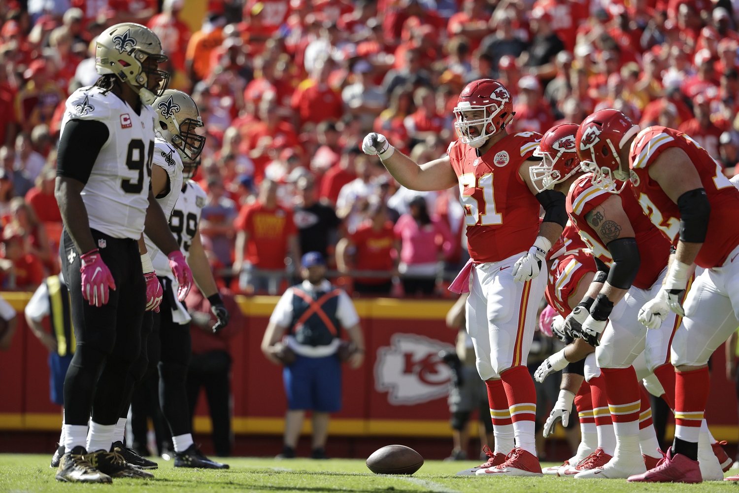 Kansas City Chiefs offensive lineman Mitch Morse (61) stands over the ball at the line of scrimmage during the first half of an NFL football game against the New Orleans Saints in Kansas City, Mo., Sunday, Oct. 23, 2016. (AP Photo/Jeff Roberson)