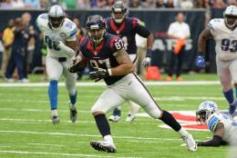 Houston Texans tight end C.J. Fiedorowicz (87) runs past Detroit Lions defender Tavon Wilson (32) during the first half of an NFL football game Sunday, October, 30, 2016, in Houston. (AP Photo/George Bridges)