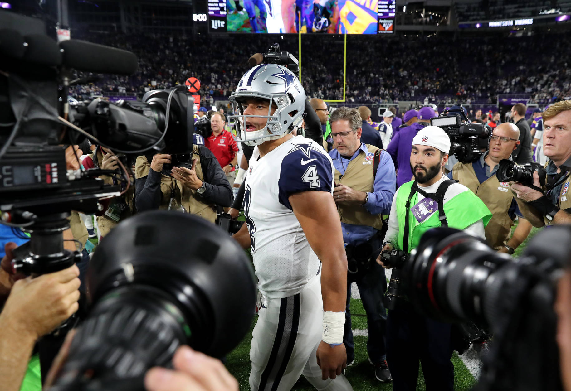 MINNEAPOLIS, MN - DECEMBER 1: Dak Prescott #4 of the Dallas Cowboys is surrounded by cameras after the game against the Minnesota Vikings on December 1, 2016 at US Bank Stadium in Minneapolis, Minnesota. The Cowboys defeated the Vikings 17-15. (Photo by Adam Bettcher/Getty Images)