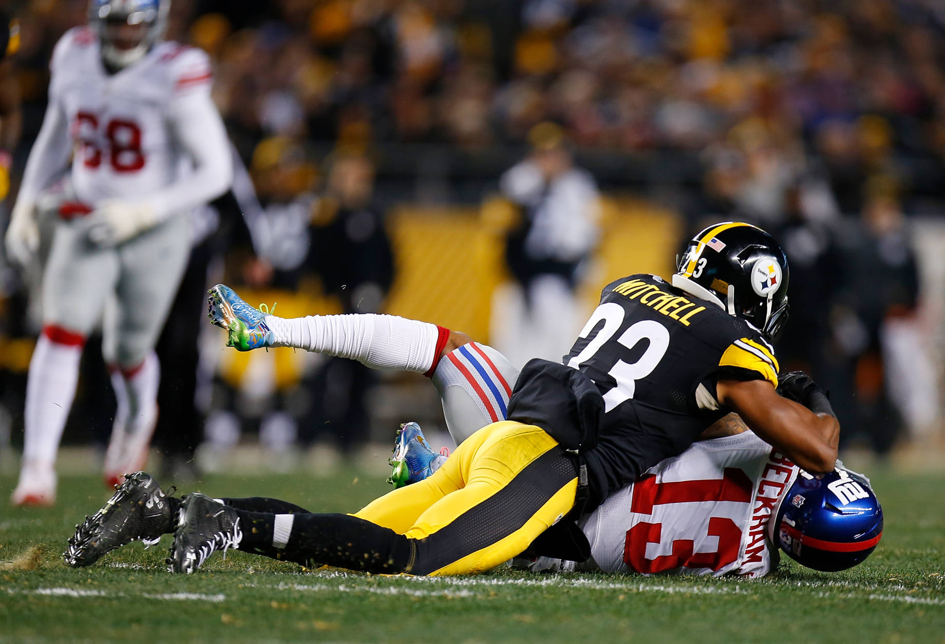 PITTSBURGH, PA - DECEMBER 04:  Odell Beckham #13 of the New York Giants is hit by Mike Mitchell #23 of the Pittsburgh Steelers after a catch in the first half during the game at Heinz Field on December 4, 2016 in Pittsburgh, Pennsylvania. (Photo by Justin K. Aller/Getty Images)