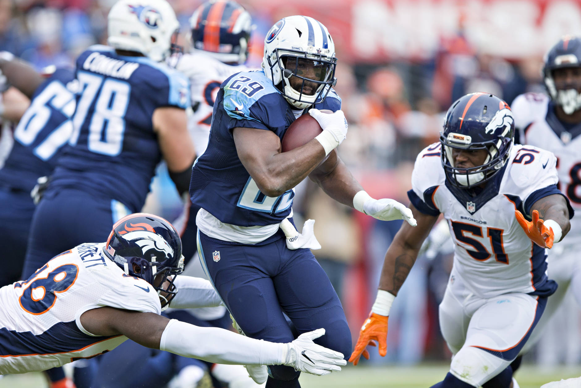 NASHVILLE, TN - DECEMBER 11:  DeMarco Murray #29 of the Tennessee Titans is tackled by Shaquil Barrett #48 of the Denver Broncos at Nissan Stadium on December 11, 2016 in Nashville, Tennessee.  (Photo by Wesley Hitt/Getty Images)