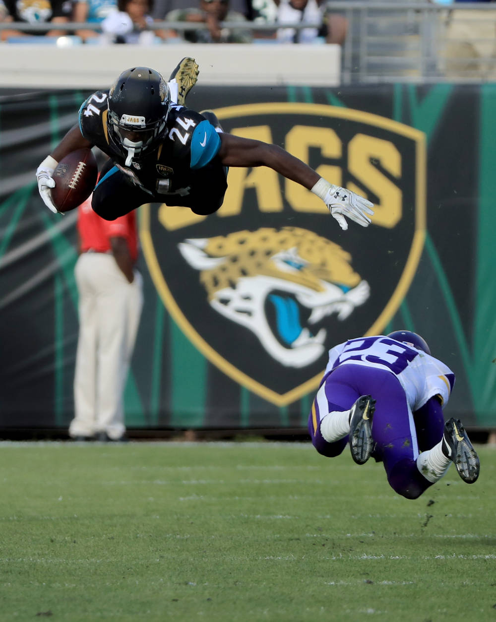 JACKSONVILLE, FL - DECEMBER 11:   T.J. Yeldon #24 of the Jacksonville Jaguars gets airborne on a tackle by Terence Newman #23 of the Minnesota Vikings during the game at EverBank Field on December 11, 2016 in Jacksonville, Florida.  (Photo by Sam Greenwood/Getty Images)