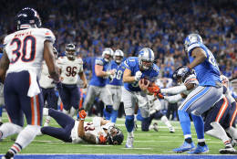 DETROIT, MI - DECEMBER 11: Quarterback Matthew Stafford #9 of the Detroit Lions scrambles for a touchdown against the Chicago Bears during fourth quarter action  at Ford Field on December 11, 2016 in Detroit, Michigan. (Photo by Leon Halip/Getty Images)