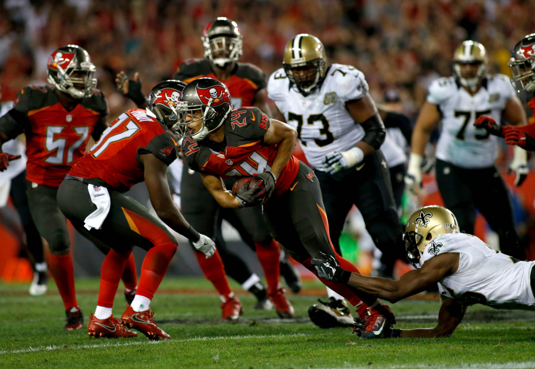 TAMPA, FL - DECEMBER 11:  Cornerback Brent Grimes #24 of the Tampa Bay Buccaneers is stopped by wide receiver Brandon Coleman #16 of the New Orleans Saints after intercepting a pass by quarterback Drew Brees during the fourth quarter of an NFL game on December 11, 2016 at Raymond James Stadium in Tampa, Florida. (Photo by Brian Blanco/Getty Images)