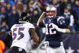 FOXBORO, MA - DECEMBER 12:  Tom Brady #12 of the New England Patriots throws a pass as he is pressured by Terrell Suggs #55 of the Baltimore Ravens during the first half of their game at Gillette Stadium on December 12, 2016 in Foxboro, Massachusetts.  (Photo by Adam Glanzman/Getty Images)