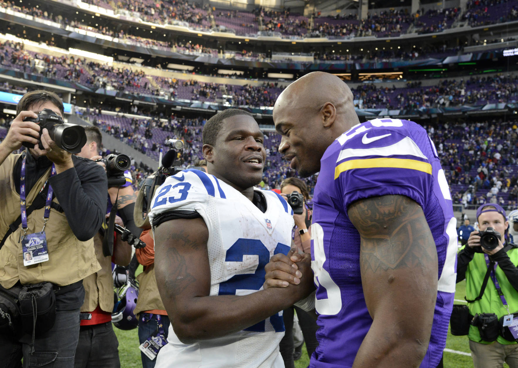 MINNEAPOLIS, MN - DECEMBER 18: Frank Gore #23 of the Indianapolis Colts and Adrian Peterson #28 of the Minnesota Vikings greet each other after the game on December 18, 2016 at US Bank Stadium in Minneapolis, Minnesota. The Colts defeated the Vikings 34-6. (Photo by Hannah Foslien/Getty Images)
