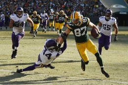GREEN BAY, WI - DECEMBER 24:  Jordy Nelson #87 of the Green Bay Packers breaks a tackle by Andrew Sendejo #34 of the Minnesota Vikings during the second quarter of a game at Lambeau Field on December 24, 2016 in Green Bay, Wisconsin.  (Photo by Stacy Revere/Getty Images)