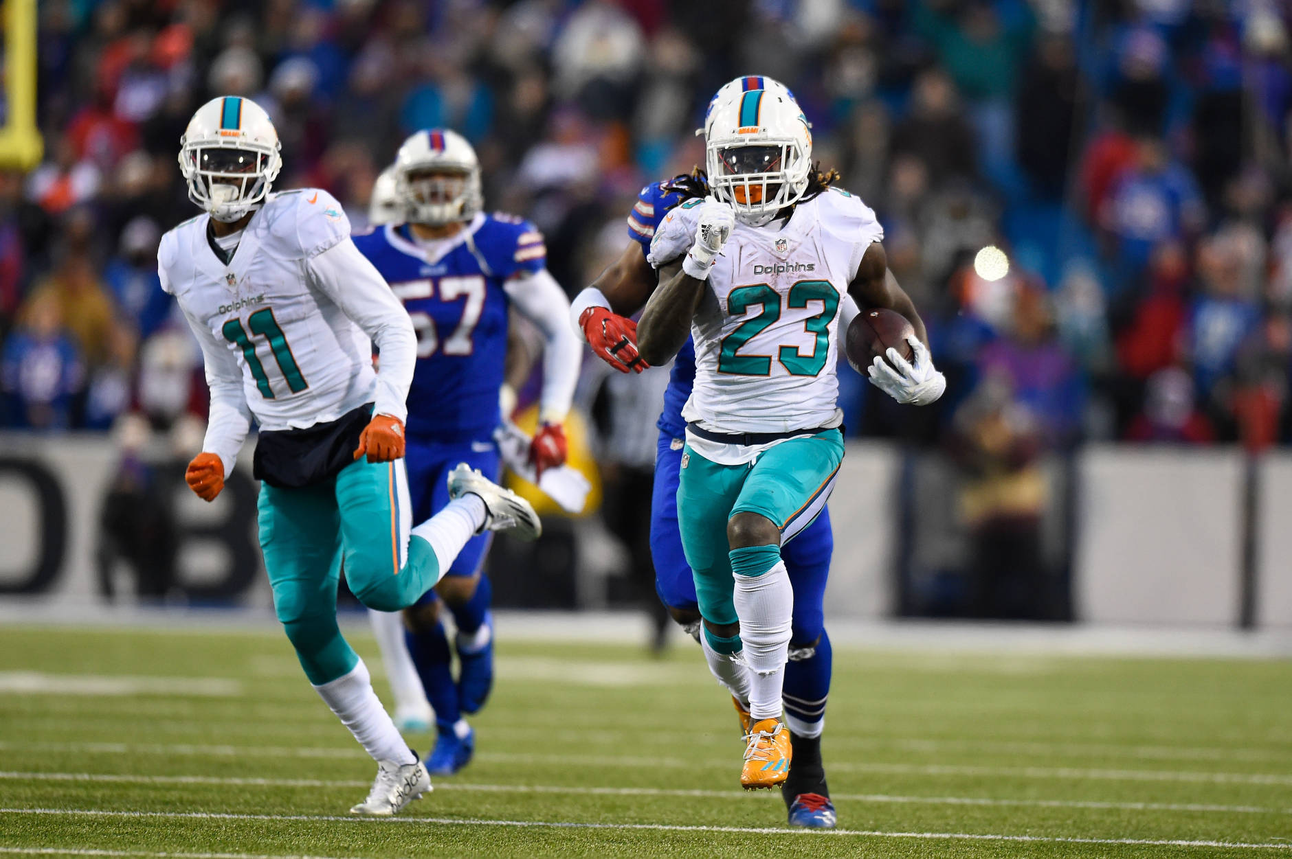 ORCHARD PARK, NY - DECEMBER 24:   Jay Ajayi #23 of the Miami Dolphins runs the ball against the Buffalo Bills during overtime at New Era Stadium on December 24, 2016 in Orchard Park, New York.  (Photo by Rich Barnes/Getty Images)